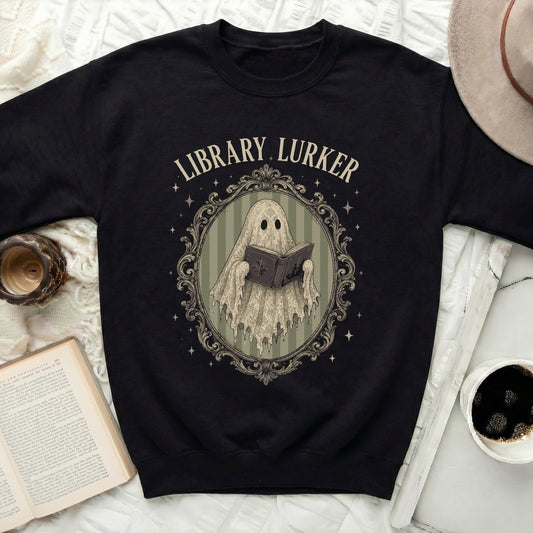 Black sweatshirt with a ghost reading a book and "Library Lurker" text.