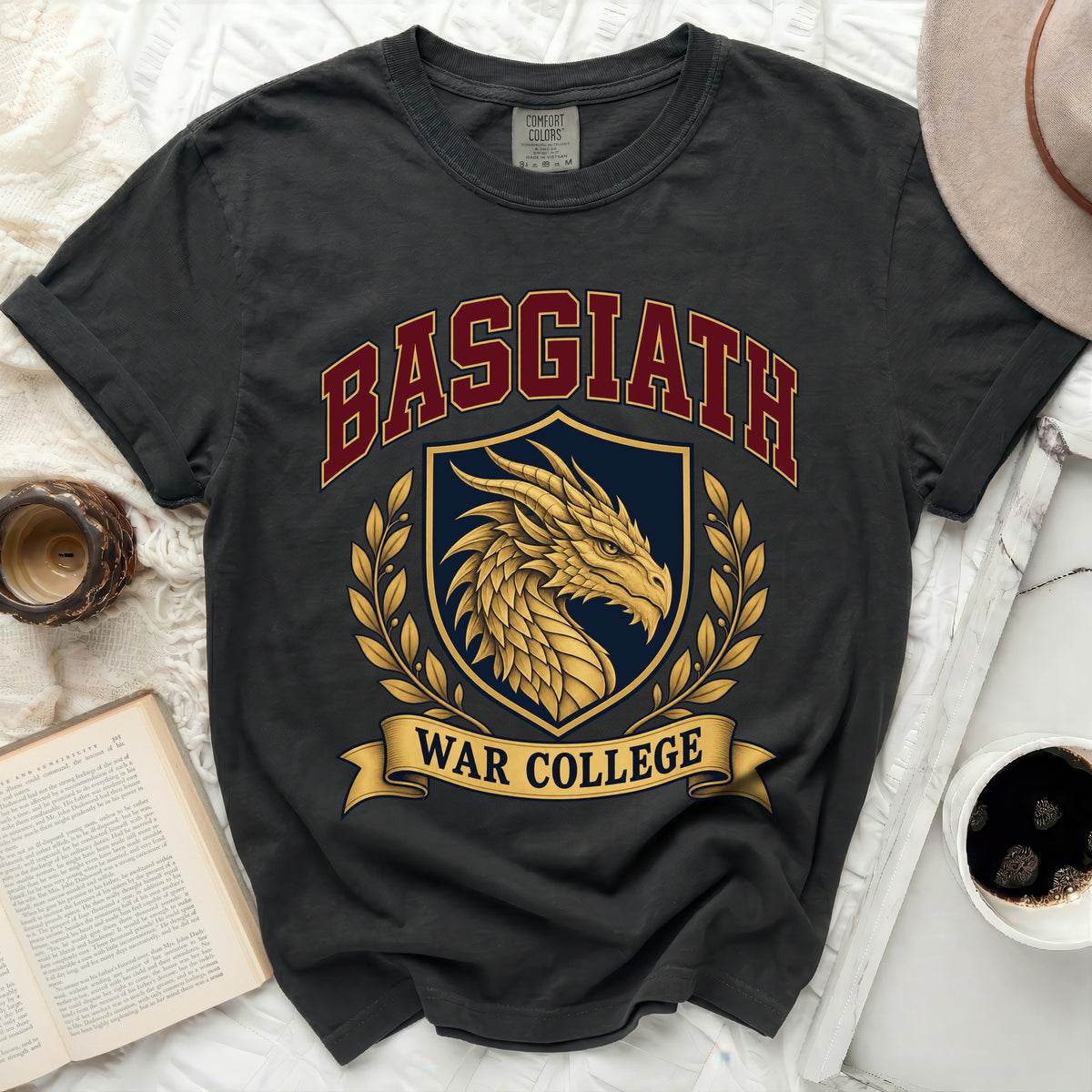 Dark grey t-shirt with "BASGIATH WAR COLLEGE" text and dragon crest graphic.