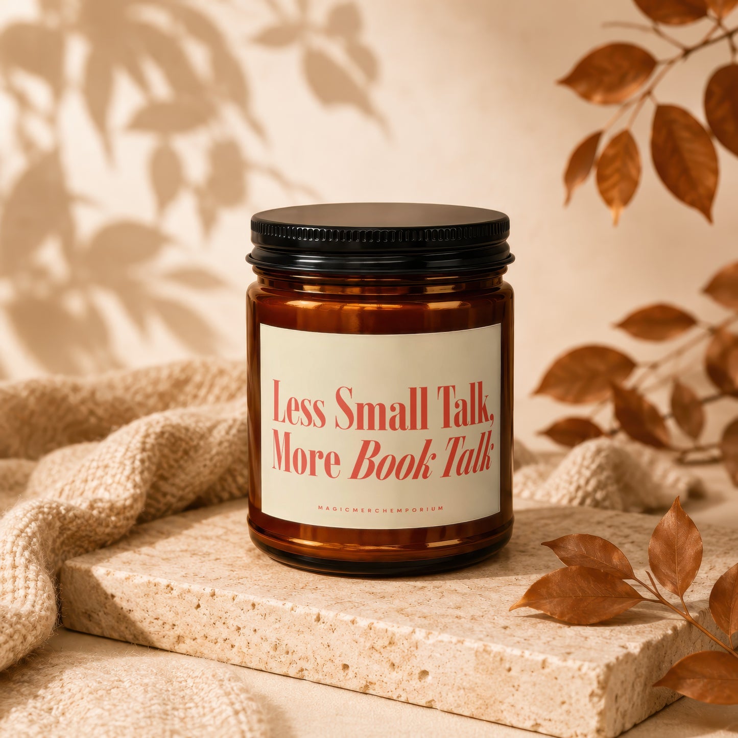 Amber jar candle with black lid, label reads "Less Small Talk, More Book Talk".