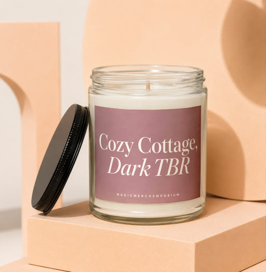 Candle labeled "Cozy Cottage, Dark TBR" with black lid on display.