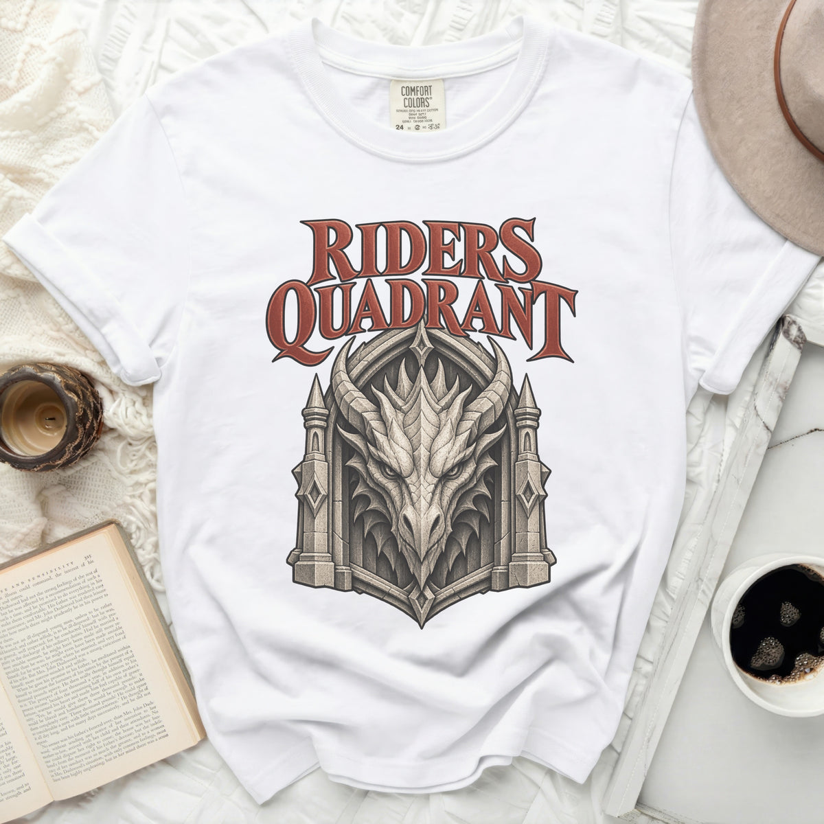 White t-shirt with "RIDERS QUADRANT" text and a stone dragon head design.