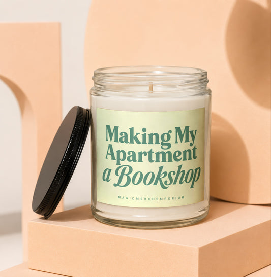 Glass candle with black lid and label reading "Making My Apartment a Bookshop".