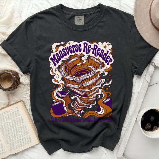 Maasverse Re-Reader t-shirt with stacked books and swirling design.