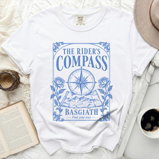 White t-shirt with "The Rider's Compass Basgiath Find your way" blue graphic.