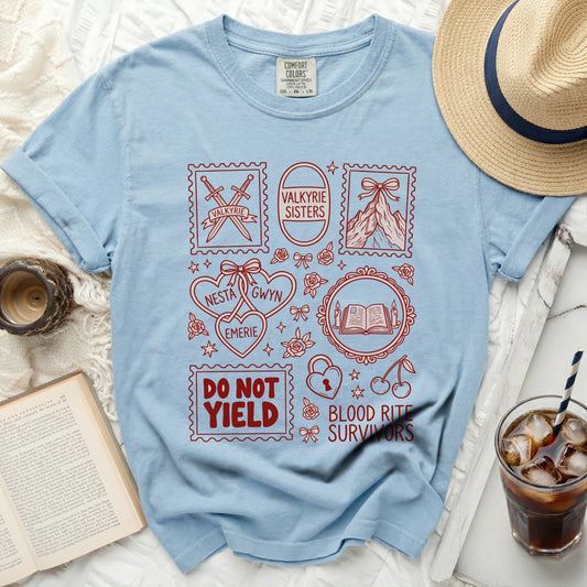 Light blue t-shirt with red stamps featuring swords, mountains, and text: Valkyrie, Valkyrie Sisters, Nesta, Emerie, Gwyn, Do Not Yield, Blood Rite Survivors.
