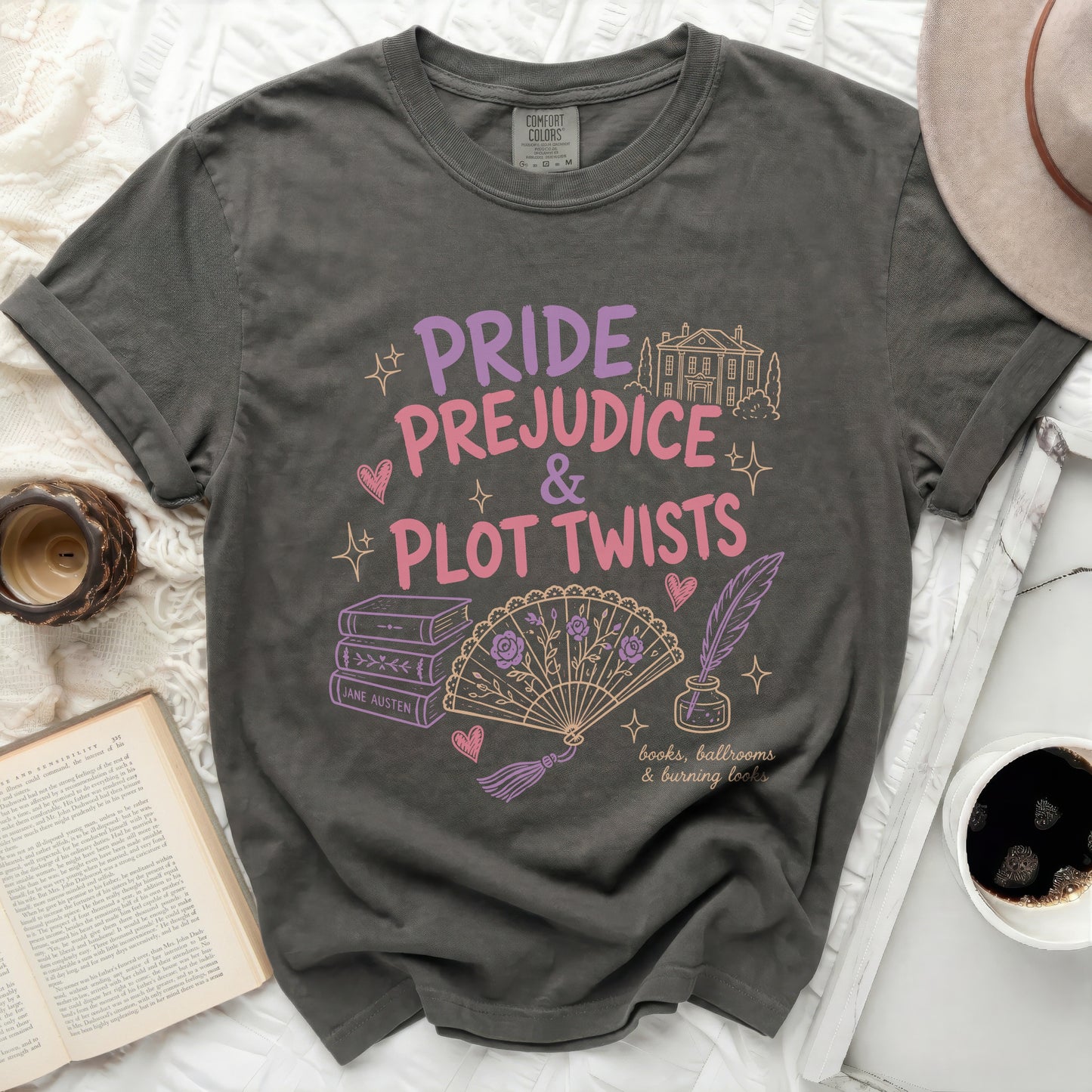 Grey t-shirt with "Pride & Prejudice & Plot Twists" and Jane Austen book illustrations.