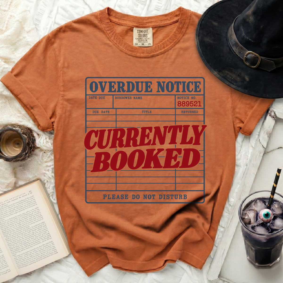 Orange t-shirt with "Overdue Notice Currently Booked Please Do Not Disturb" graphic.