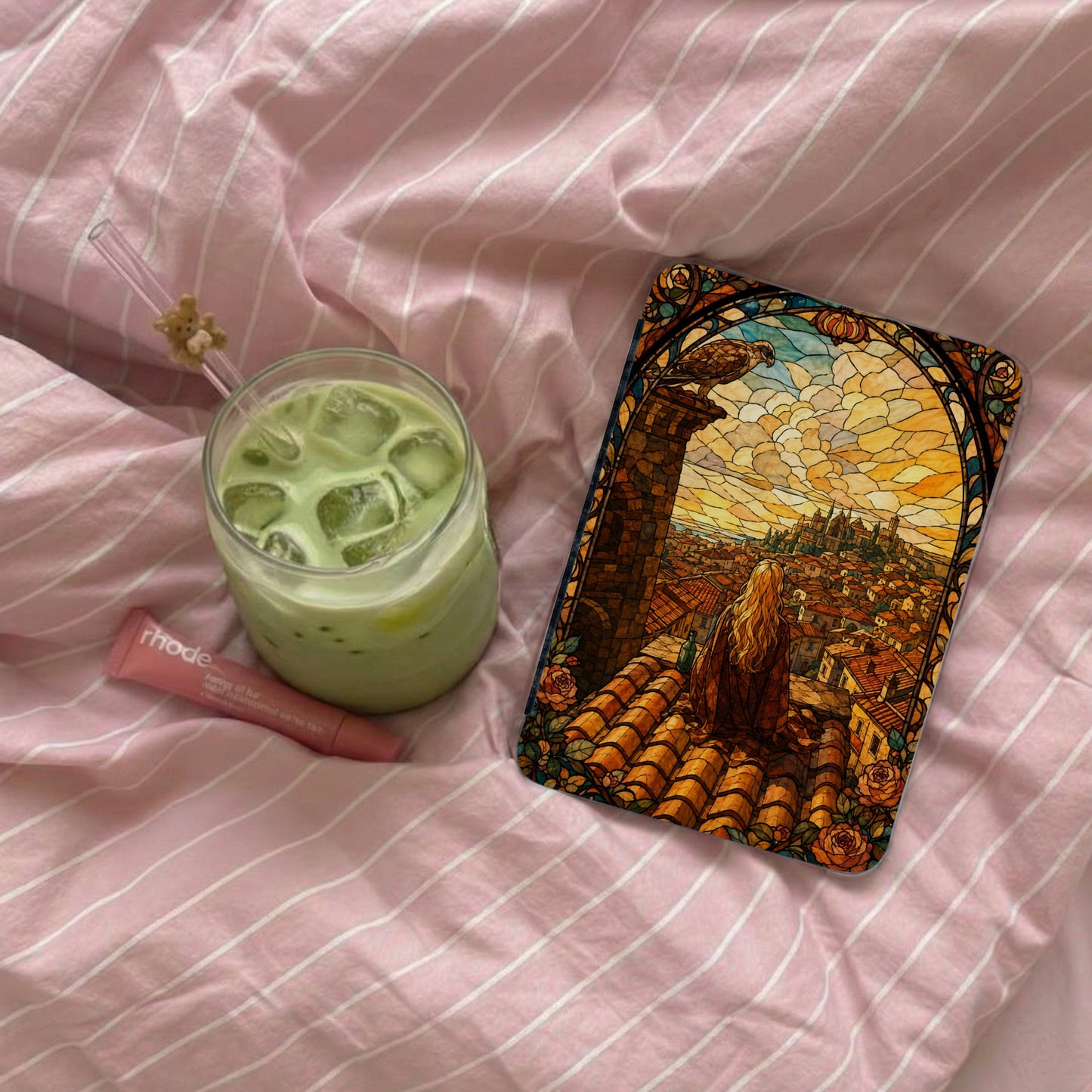 Phone case with stained glass design depicting a woman overlooking a city