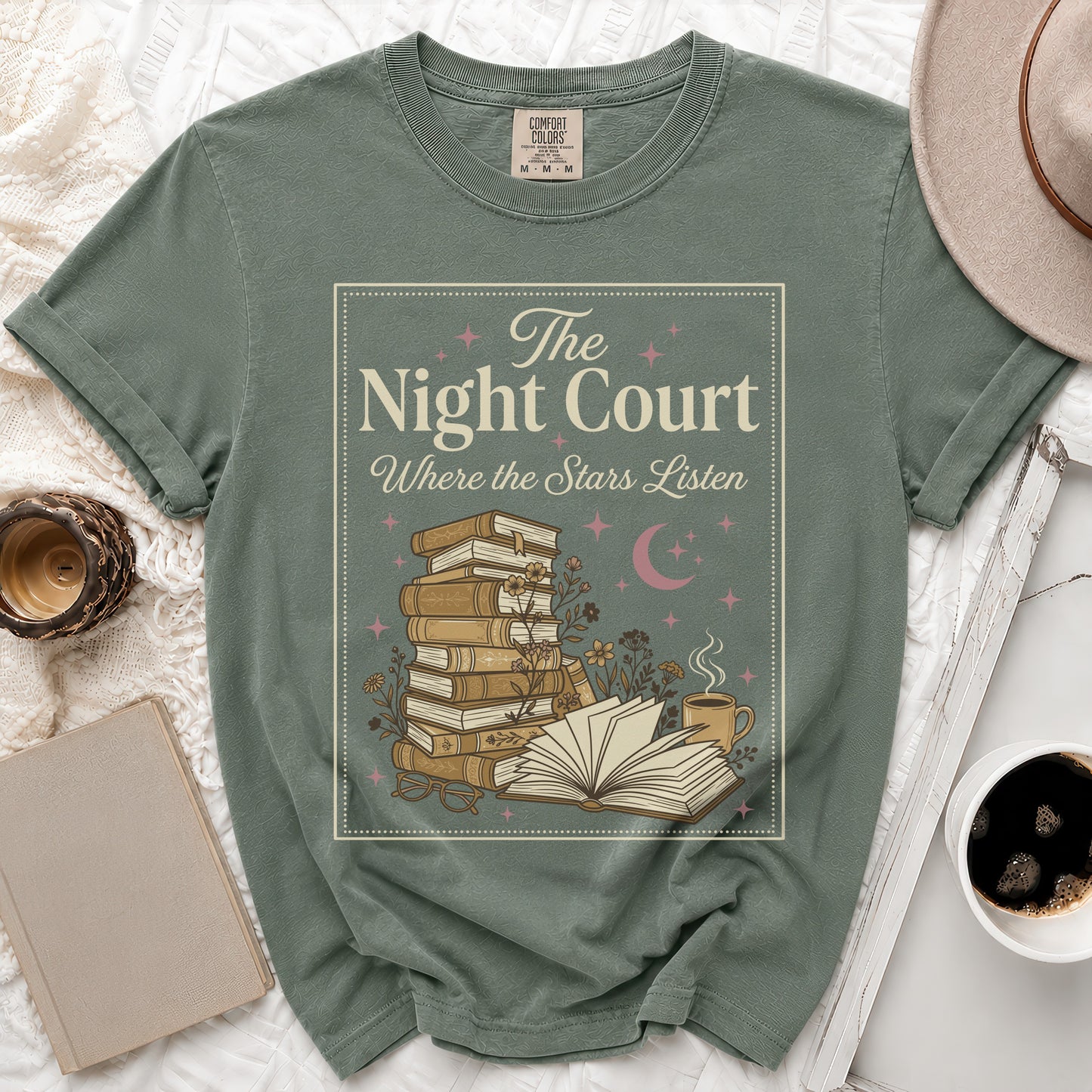 Green t-shirt with "The Night Court Where the Stars Listen" text and book illustration.