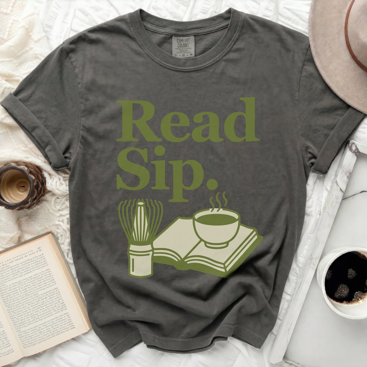 Gray t-shirt with "Read Sip." and book with tea graphic.