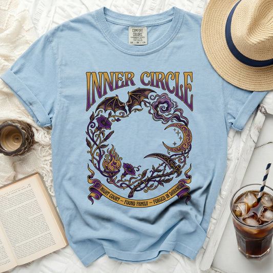 Light blue t-shirt with "Inner Circle" and mystical graphics.