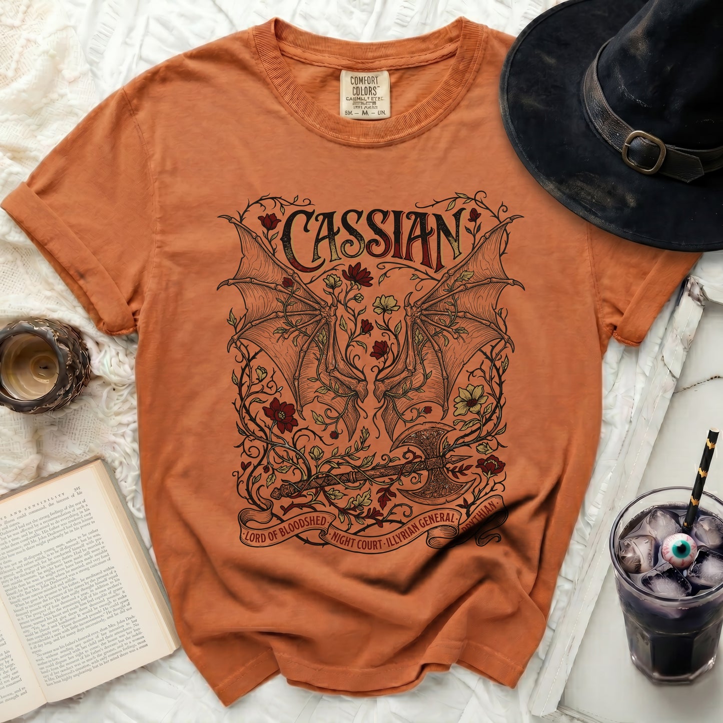 Orange t-shirt with "Cassian Lord of Bloodshed Night Court Illyrian General" text.