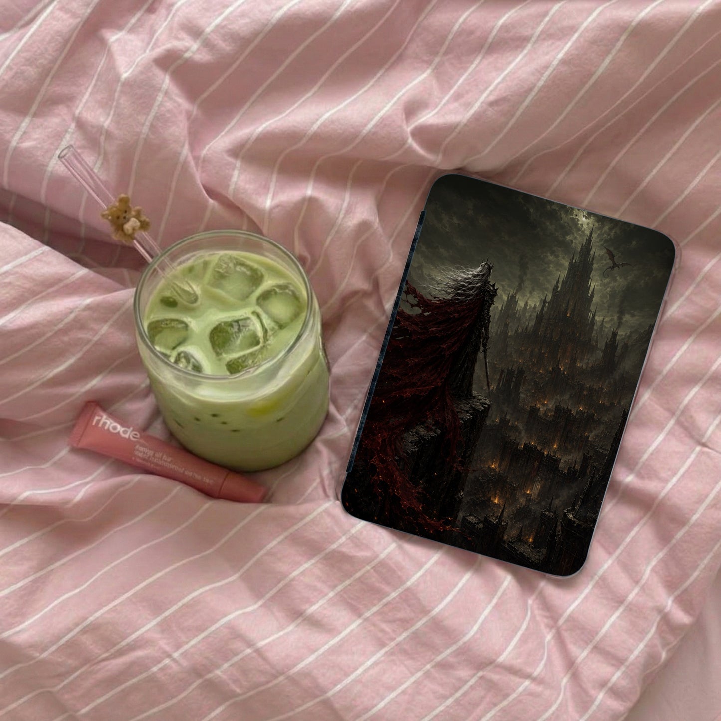 Phone case with fantasy art of a cloaked figure overlooking a dark city and castle.