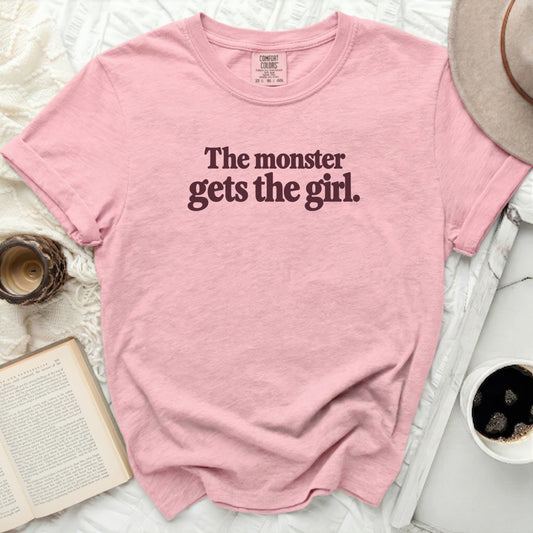 Pink Comfort Colors t-shirt with "The monster gets the girl." text.