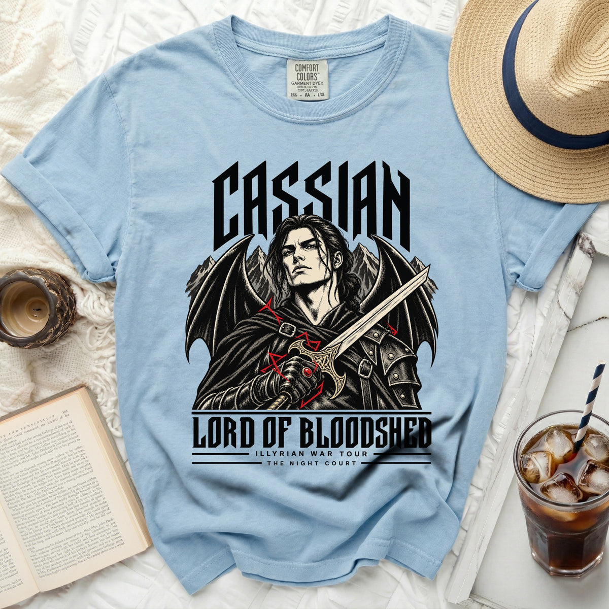 Light blue t-shirt with Cassian, Lord of Bloodshed graphic and text.