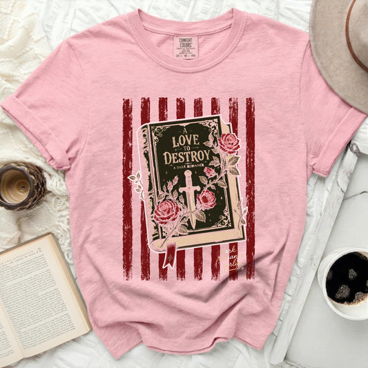 Pink t-shirt with a book cover graphic titled "Love to Destroy."