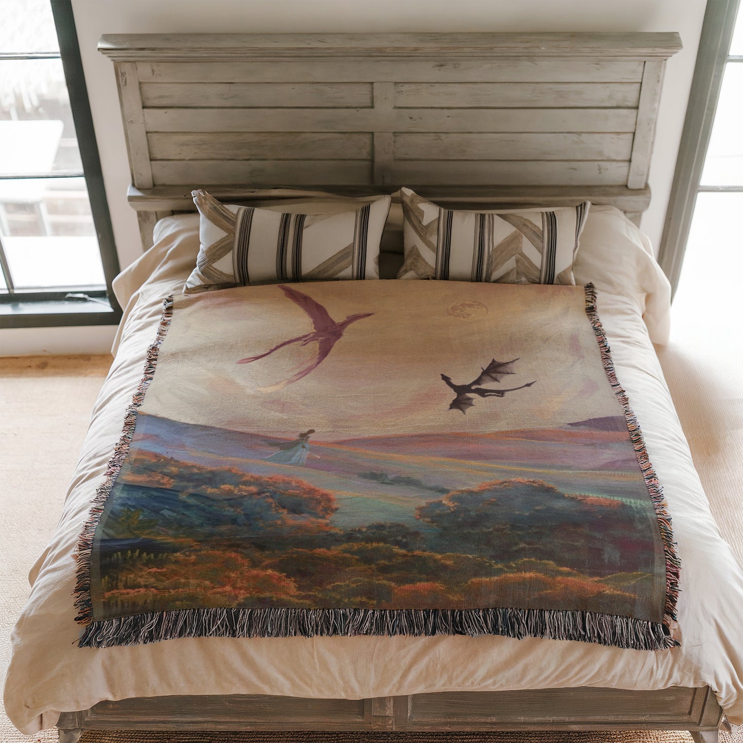 a bedroom with a bed featuring a colorful, nature-inspired blanket with a bird and landscape design.