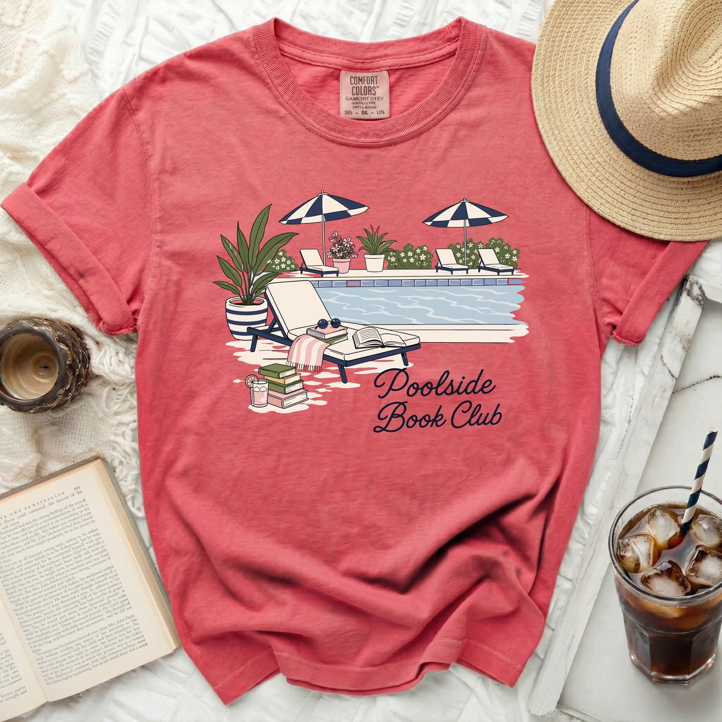 T-shirt with "Poolside Book Club" text and poolside illustration.