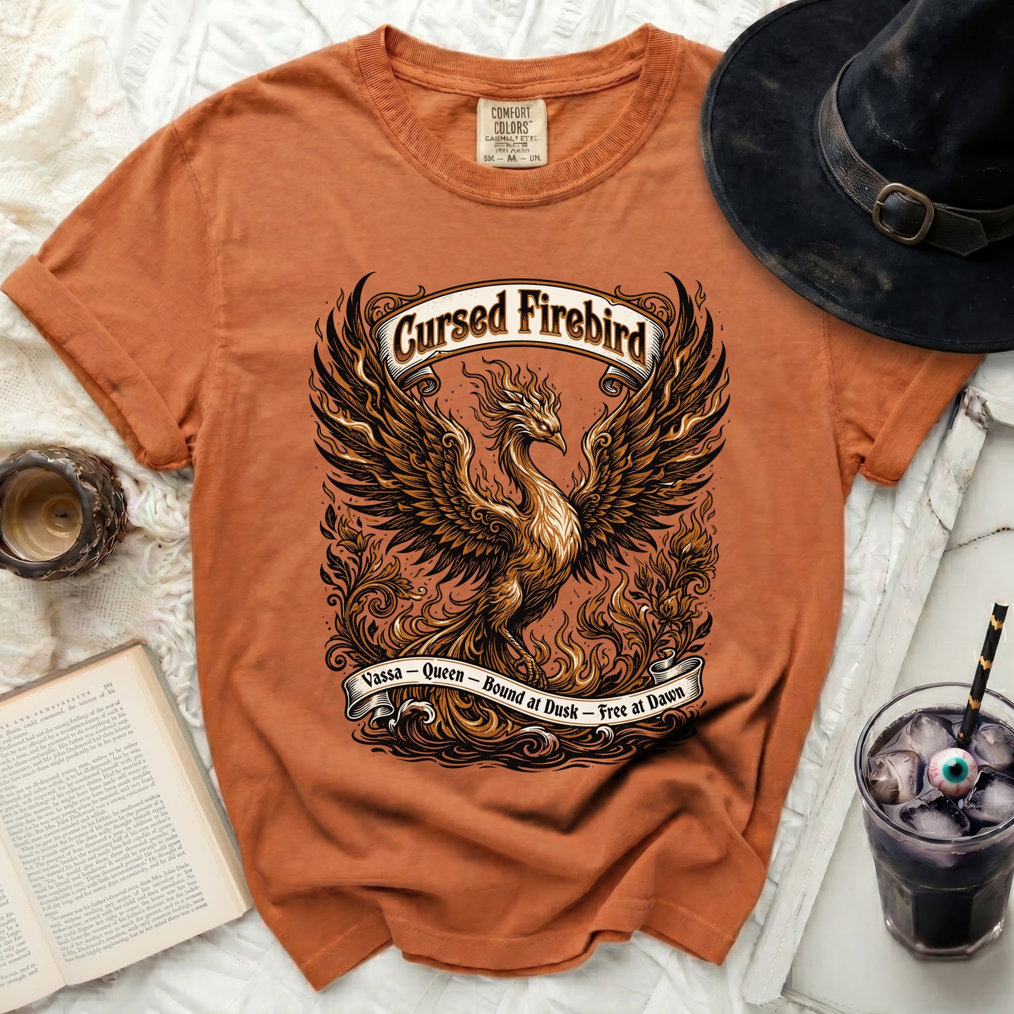 Orange t-shirt with a phoenix design and "Cursed Firebird" text.