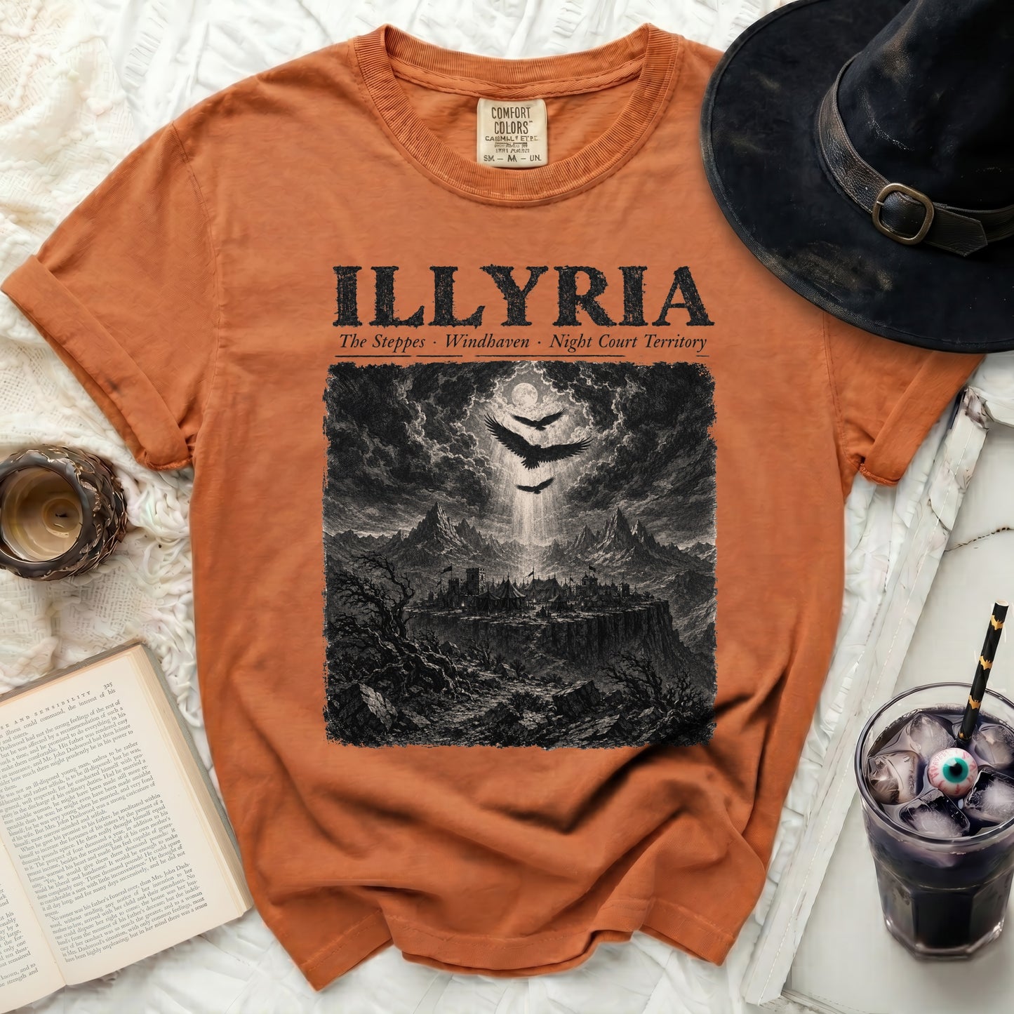 Orange t-shirt with "ILLYRIA The Steppes · Windhaven · Night Court Territory" and dark castle graphic.