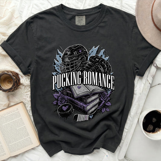 Black t-shirt with "Pucking Romance" text, hockey gear, and books design.