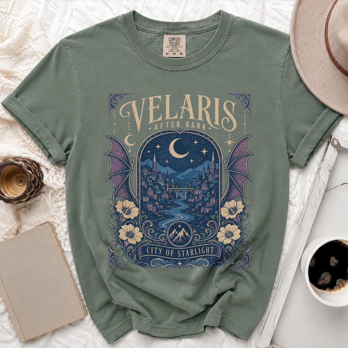 Sage green t-shirt with "Velaris After Dark City of Starlight" graphic.