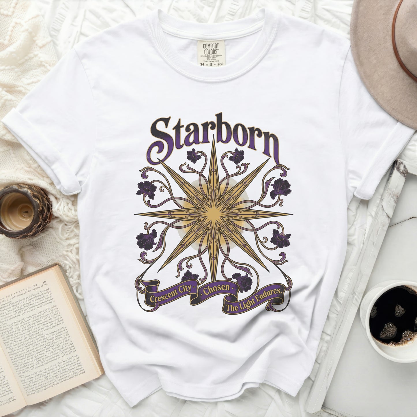 White t-shirt with "Starborn Crescent City Chosen The Light Endures" text and star design.