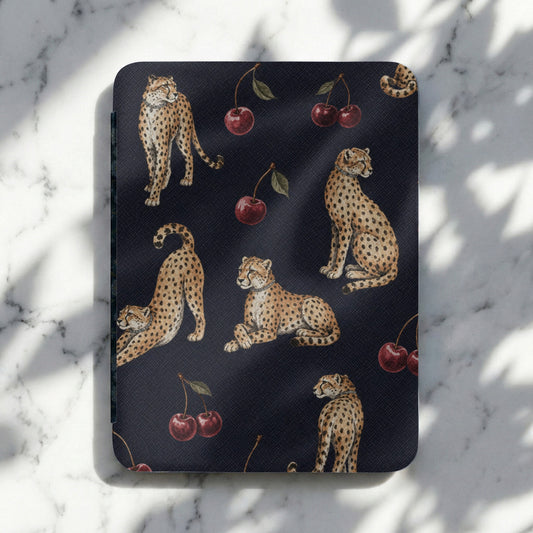 Dark blue cover with a repeating pattern of cheetahs and cherries.