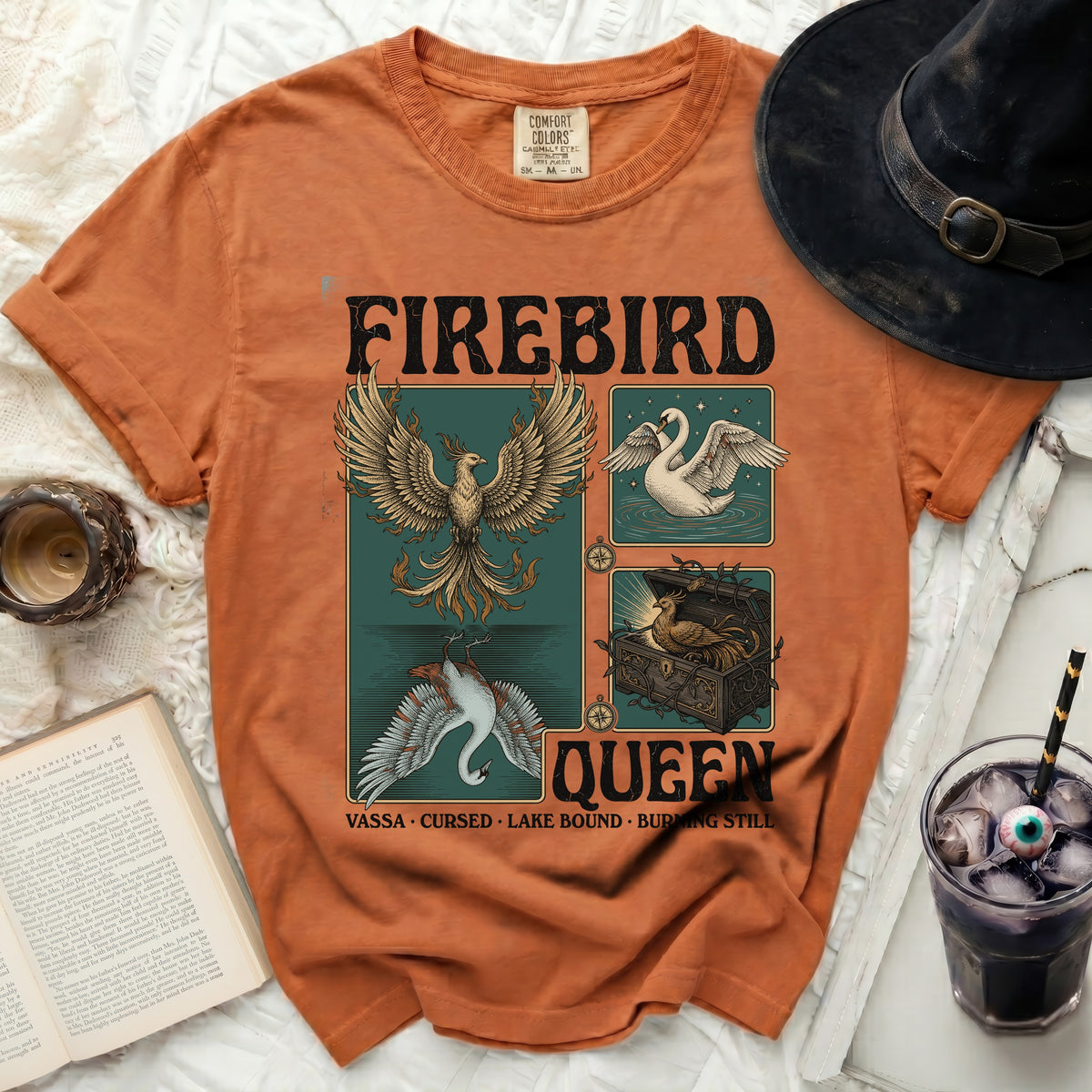 Firebird Queen t-shirt with phoenix, swan, and treasure chest designs.