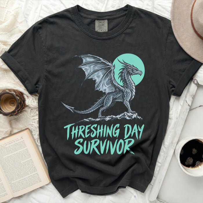 Black t-shirt with a dragon graphic and "THRESHING DAY SURVIVOR" text.