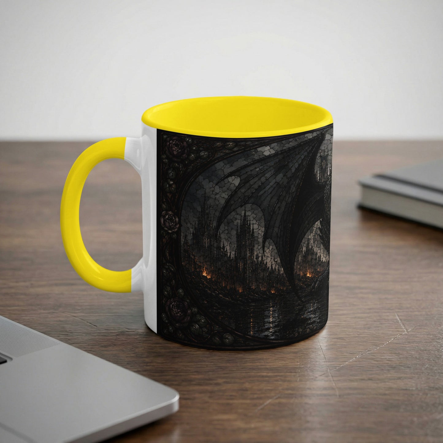 White mug with yellow handle, featuring a dark fantasy dragon wing and castle scene.