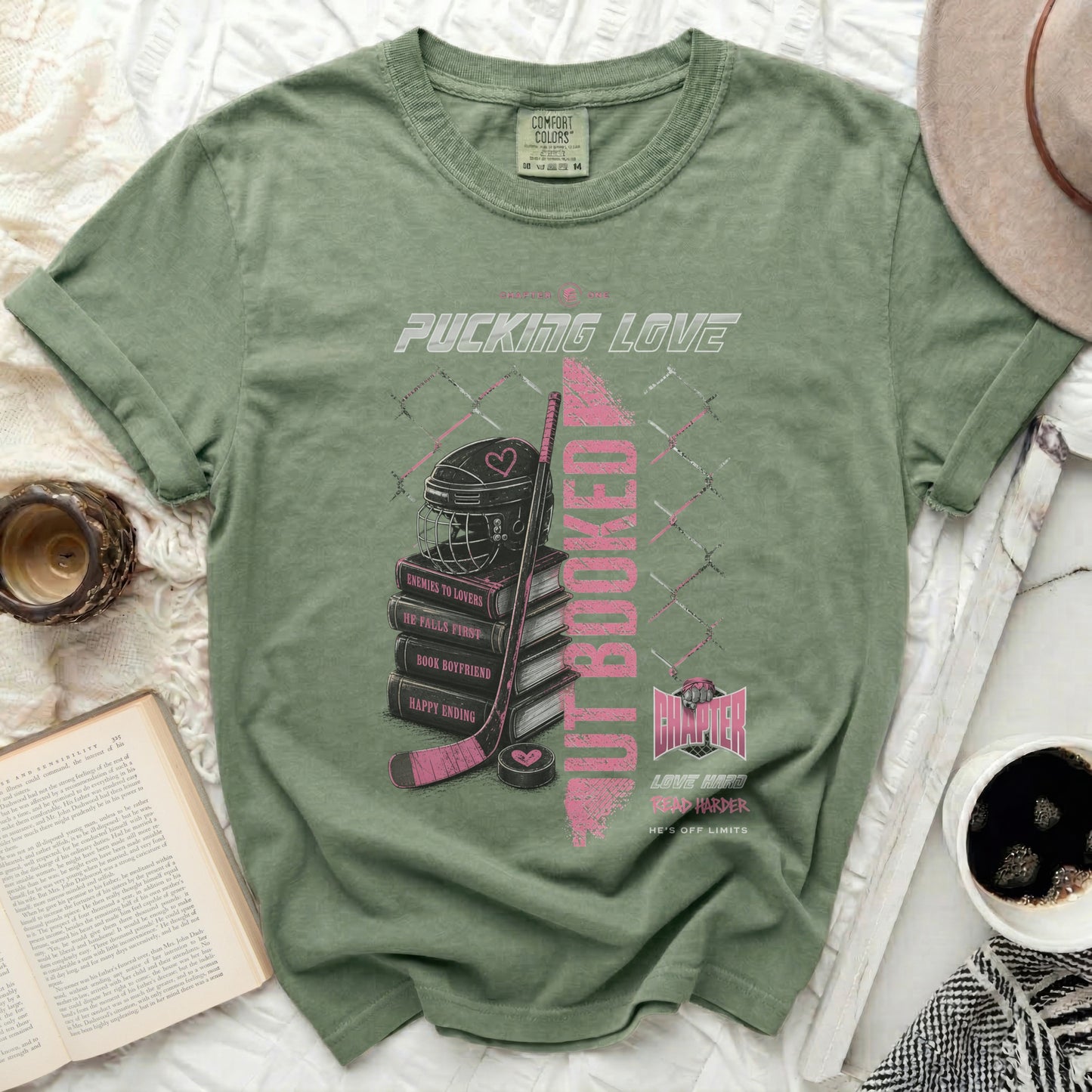 Green t-shirt with pink text and hockey theme: "Pucking Love" and "But Booked".
