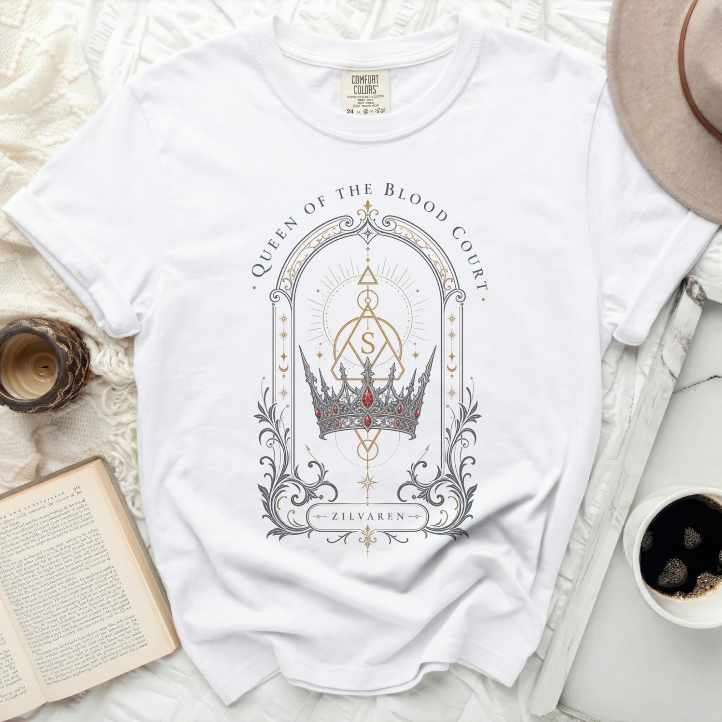 White t-shirt with a crown and geometric design, "Queen of the Blood Court" text.