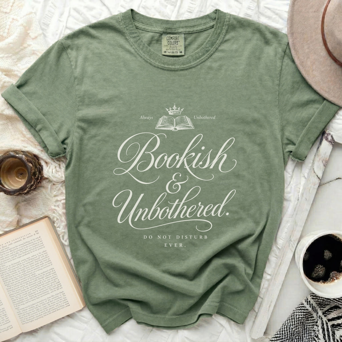Green t-shirt with "Bookish & Unbothered. Do Not Disturb Ever." text.