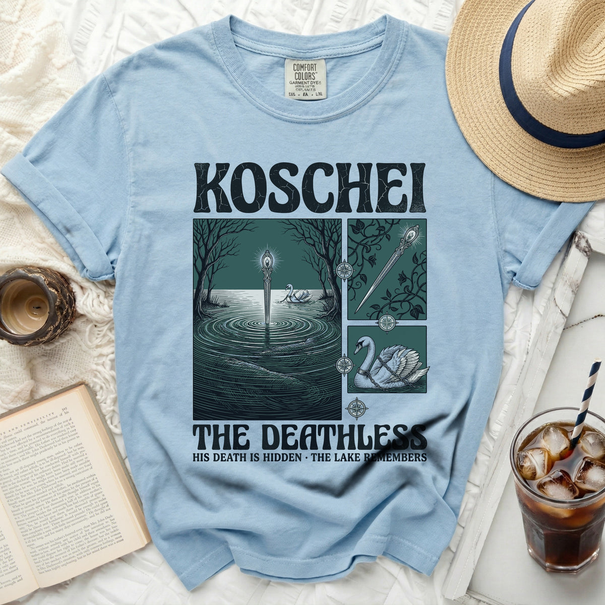 Light blue t-shirt with "KOSCHEI THE DEATHLESS" graphic and swan illustration.