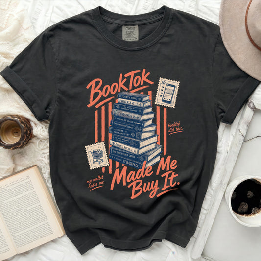 BookTok graphic tee with stacked books and "Made Me Buy It" text.