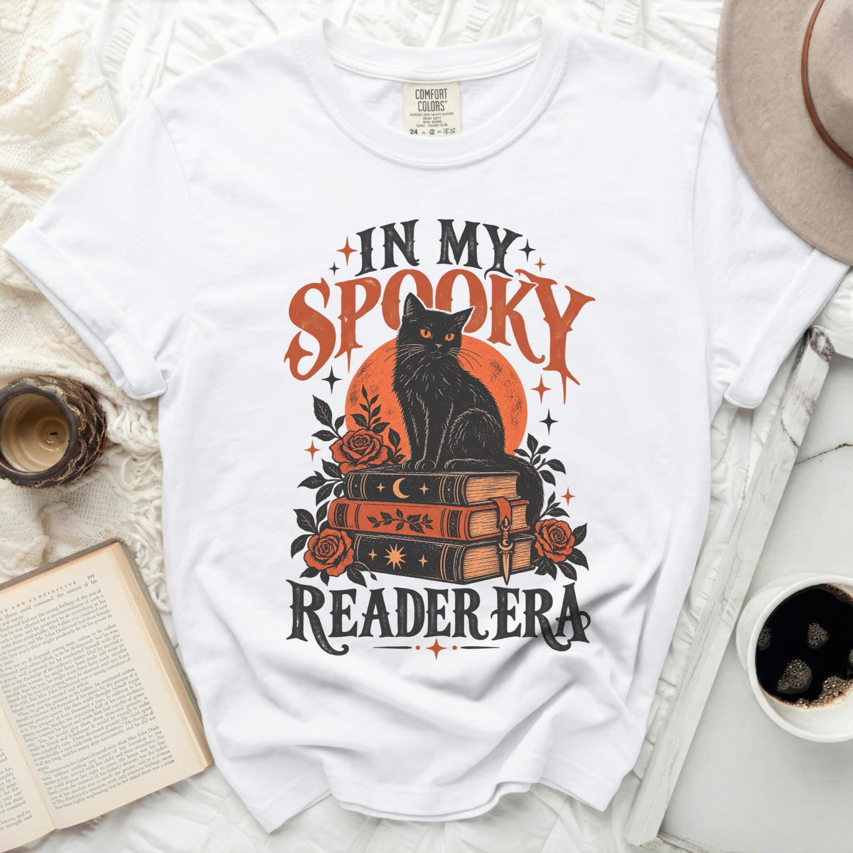 White t-shirt with "In My Spooky Reader Era" and a black cat on books.