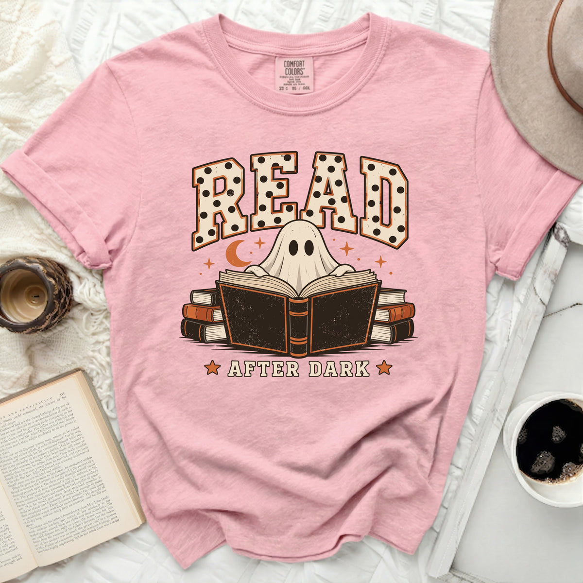 Pink t-shirt with "READ AFTER DARK" graphic featuring a ghost and books.
