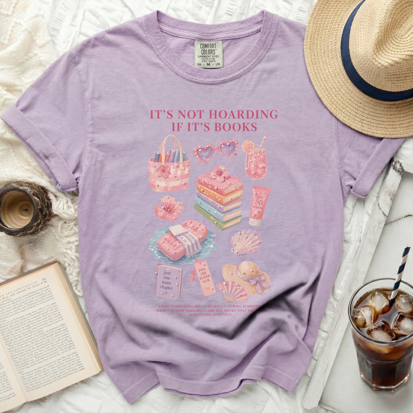 Purple t-shirt with book-themed summer graphics and text.