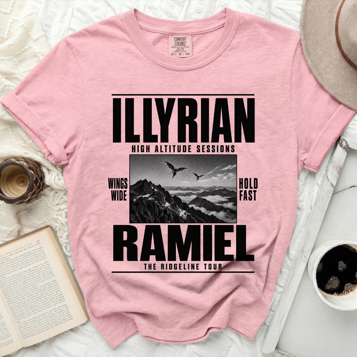 Pink t-shirt with "ILLYRIAN HIGH ALTITUDE SESSIONS" and "RAMIEL THE RIDGELINE TOUR" text.