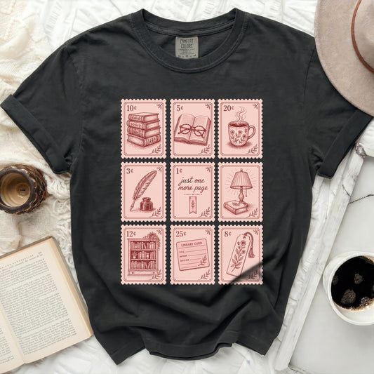 Black t-shirt with nine square illustrations of books and stationery.