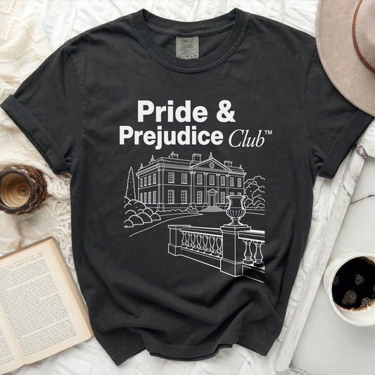 Dark t-shirt with "Pride & Prejudice Club™" and line art of a mansion.