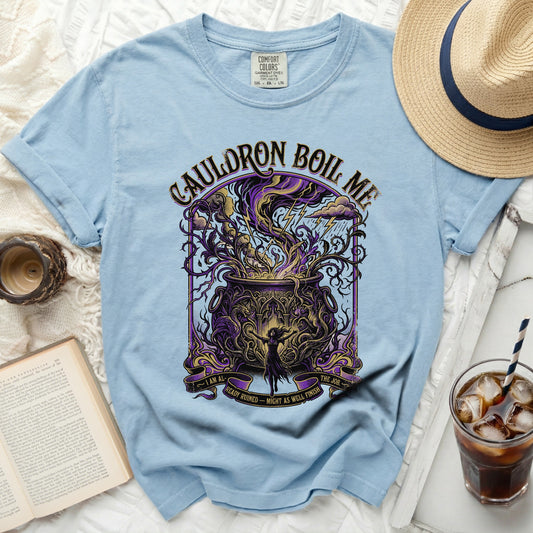 Light blue t-shirt with "Cauldron Boil Me" and witch graphic.