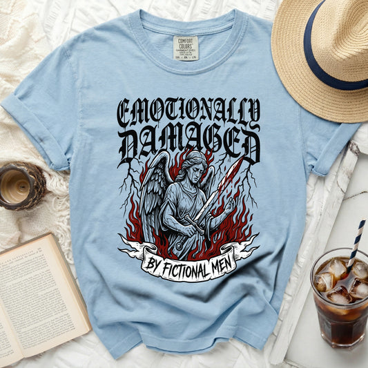 Light blue t-shirt with "Emotionally Damaged By Fictional Men" graphic.