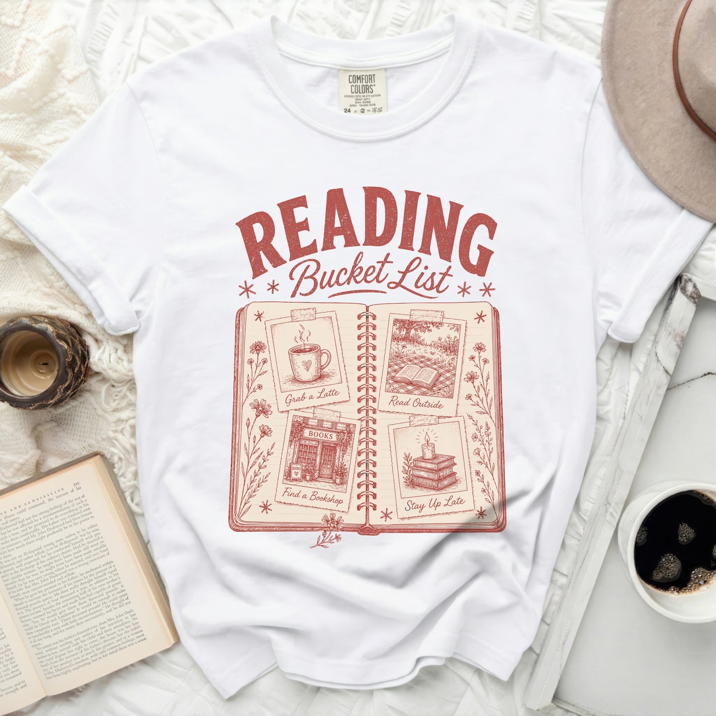 White t-shirt with "Reading Bucket List" and four book-themed activities.