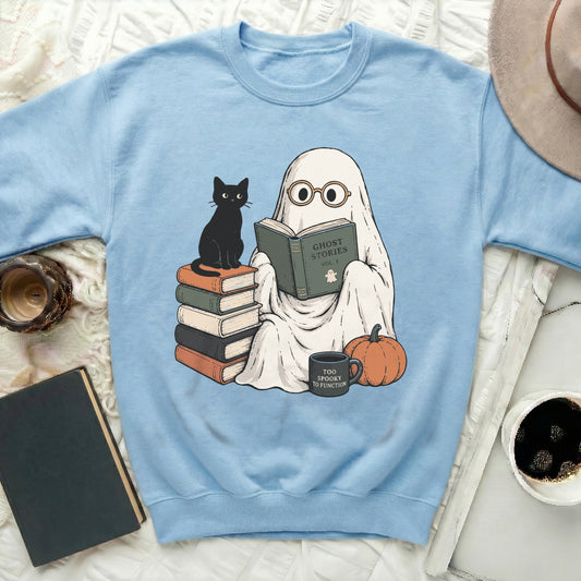 Ghost reading "Ghost Stories Vol. 1" next to a black cat on books.