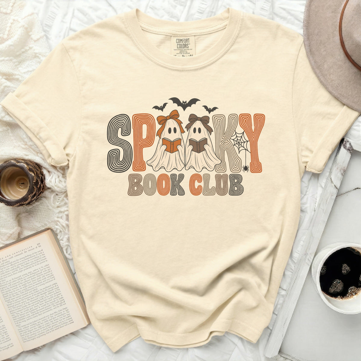 Comfort Colors t-shirt with "Spooky Book Club" graphic featuring ghosts reading books.