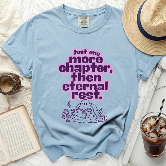 Light blue t-shirt with ghost reading a book and text "Just one more chapter, then eternal rest."