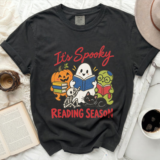 Black t-shirt with "It's Spooky Reading Season" and Halloween characters reading books.