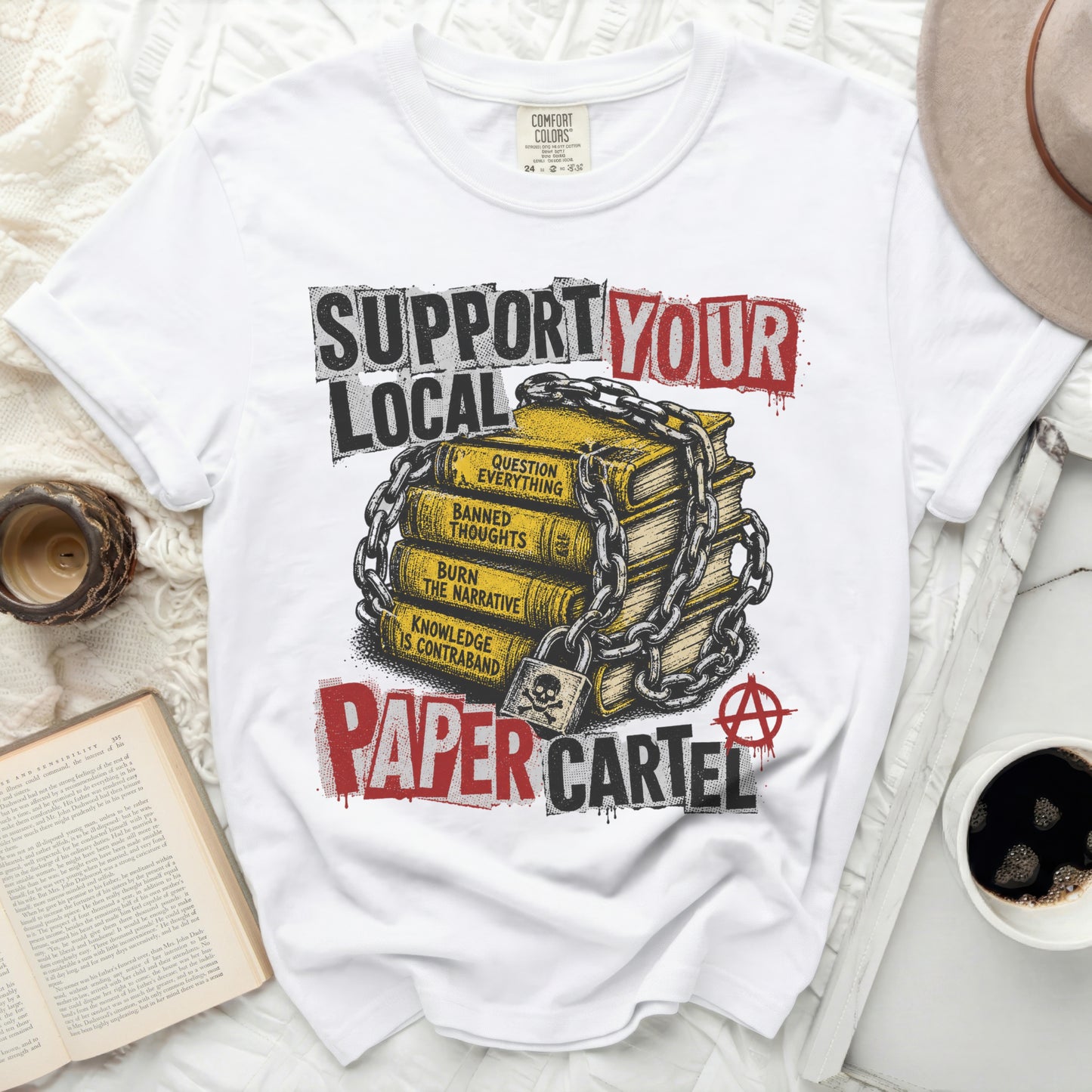T-shirt with "SUPPORT YOUR LOCAL PAPER CARTEL" and book stack graphic.